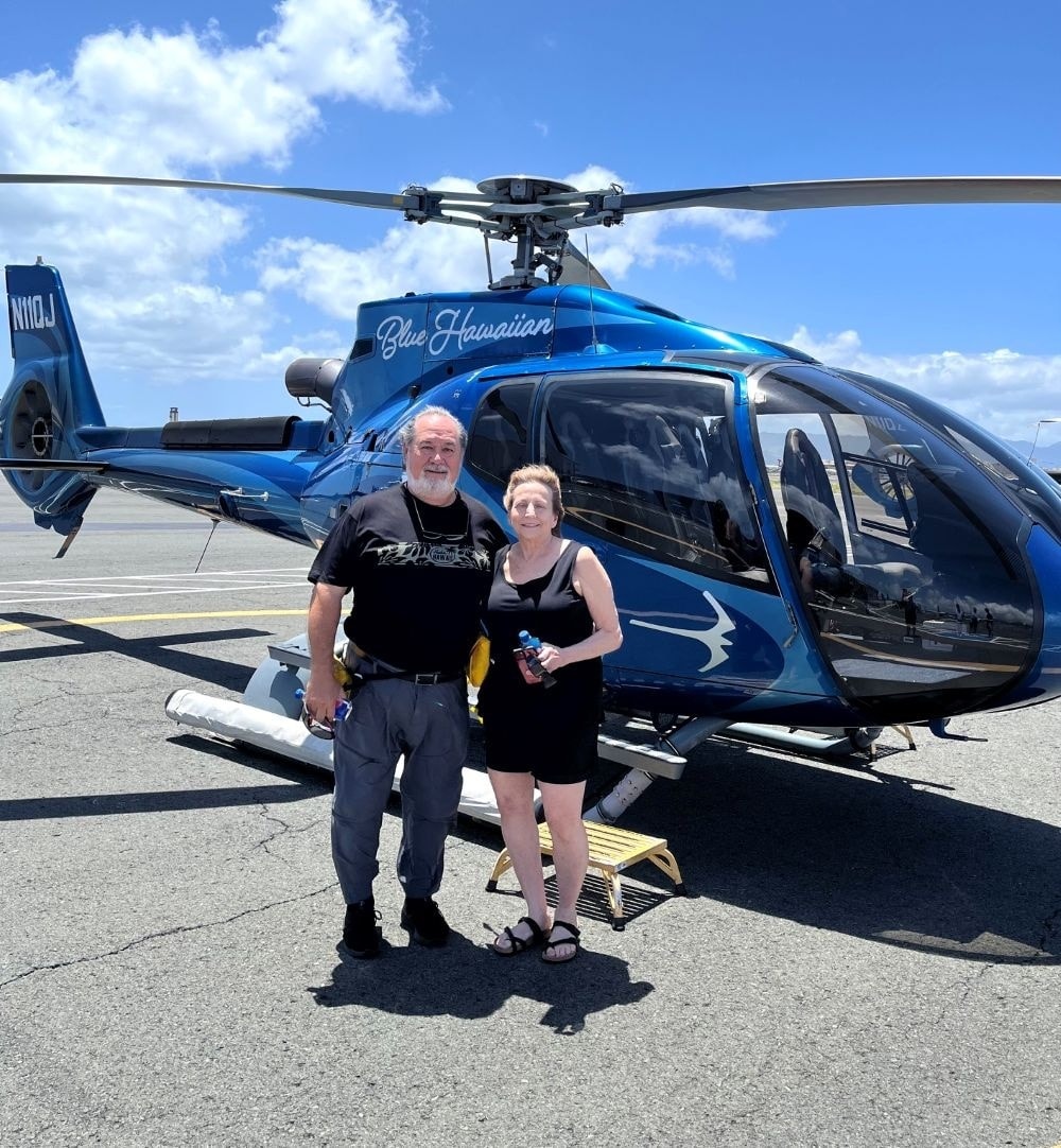 V. Les and Daren with helicopter Honolulu 2026