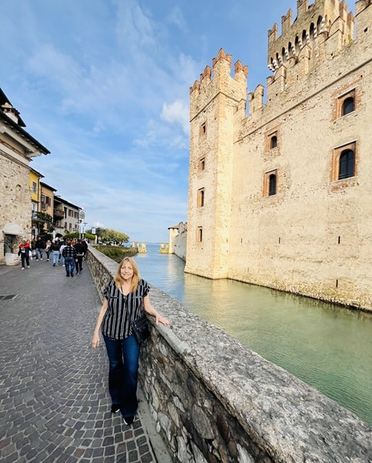 Daren walking medieval castle waterfront