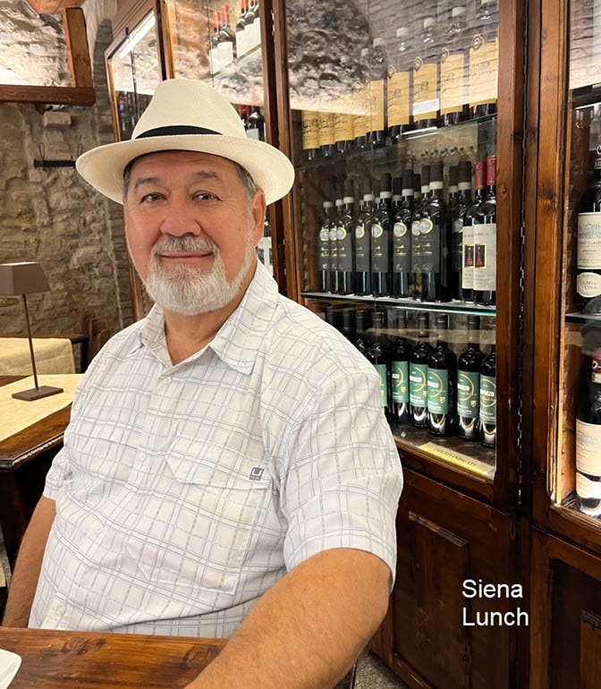 V. Les Rogers at wine shop counter Siena lunch
